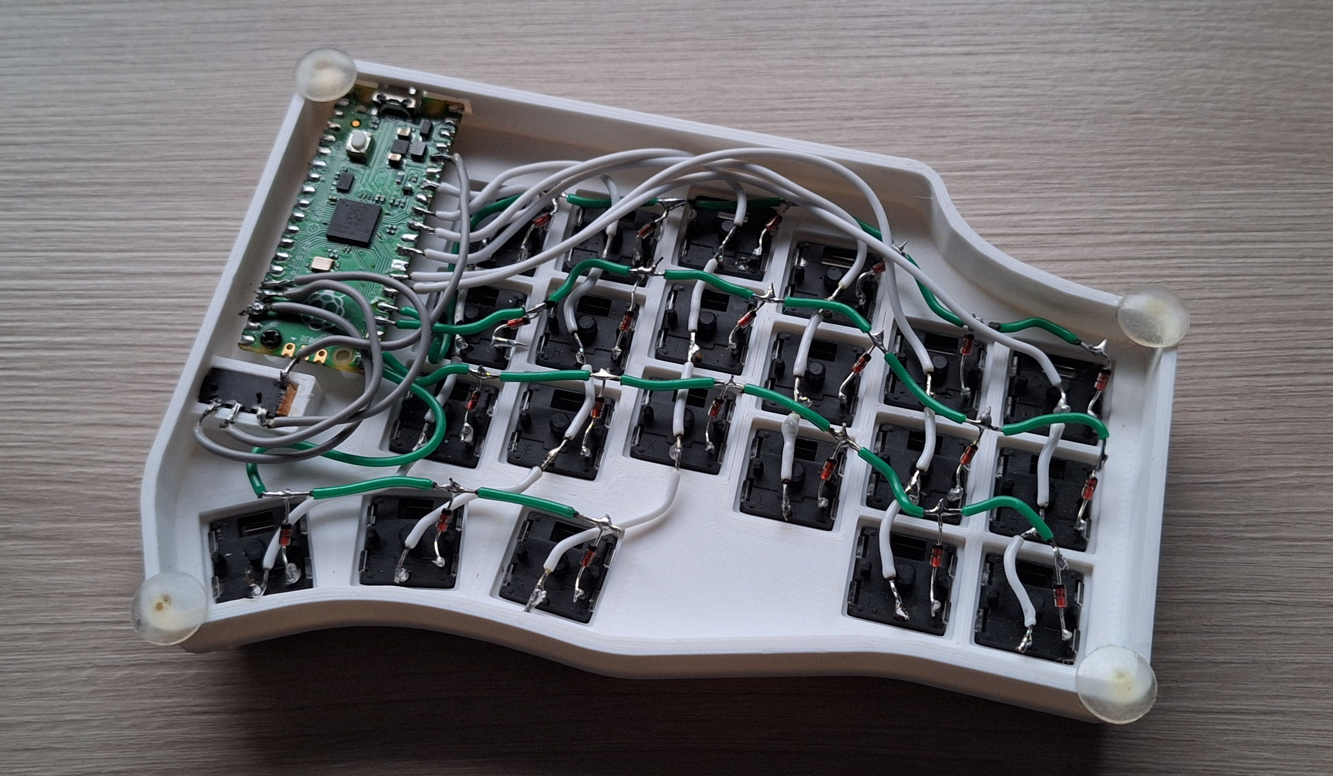 Lots of wires soldered into a matrix and micro controller